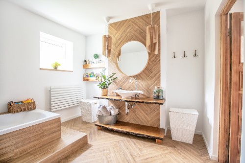 This picture shows a modern bathroom design with a wooden vanity.