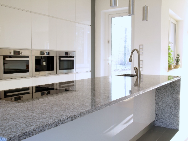 The granite countertop in this kitchen gives it a durable, cost-effective, and beautiful aspect of the overall kitchen.