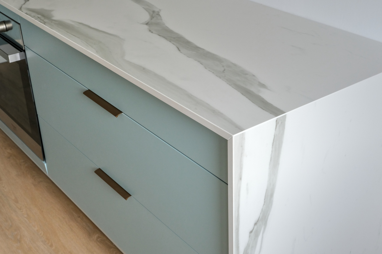 Close-up of granite countertop slab with unique veining in a kitchen.