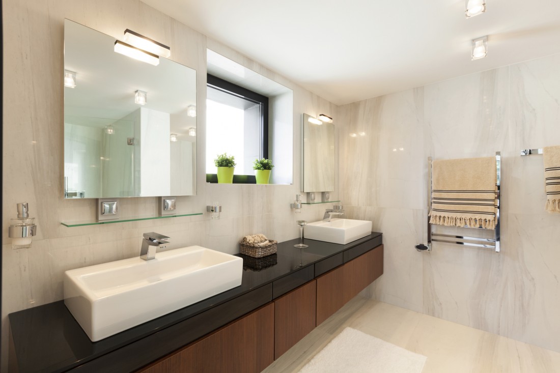 KDI Kitchen modern bathroom design with floating vanity, vessel sinks, and marble wall tile