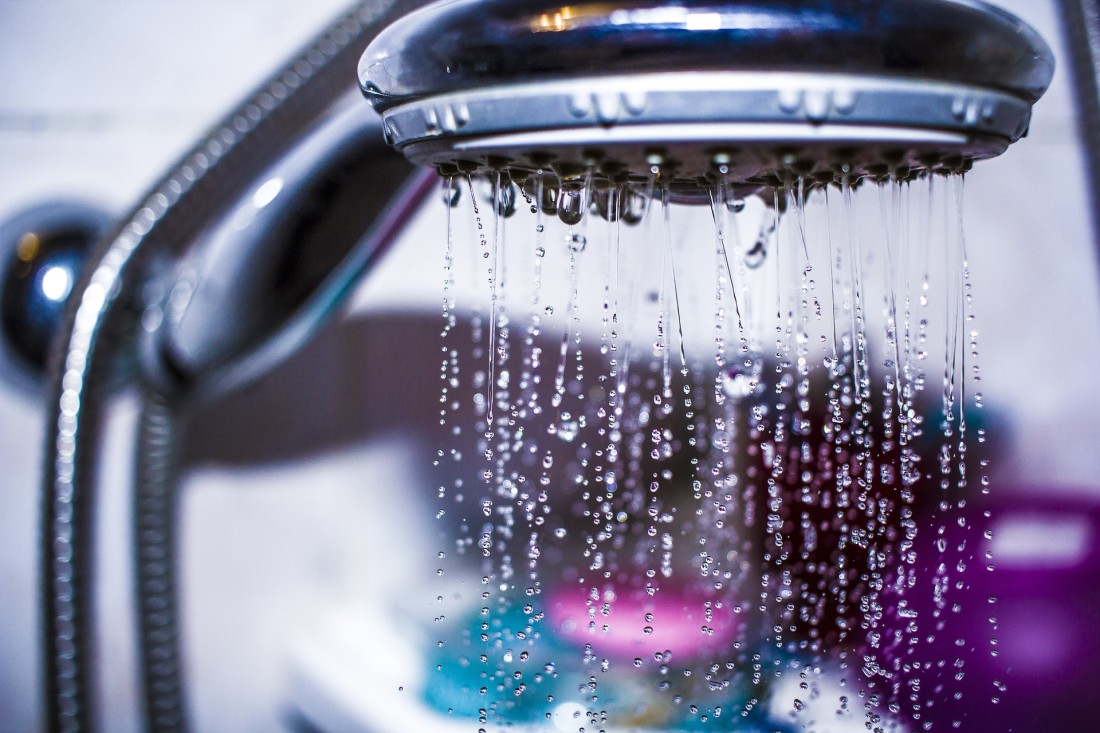 Water pouring out of a showerhead 