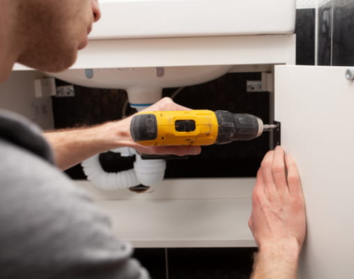 A photo of cabinet contractor installing cabinet in Trenton and Wyandotte